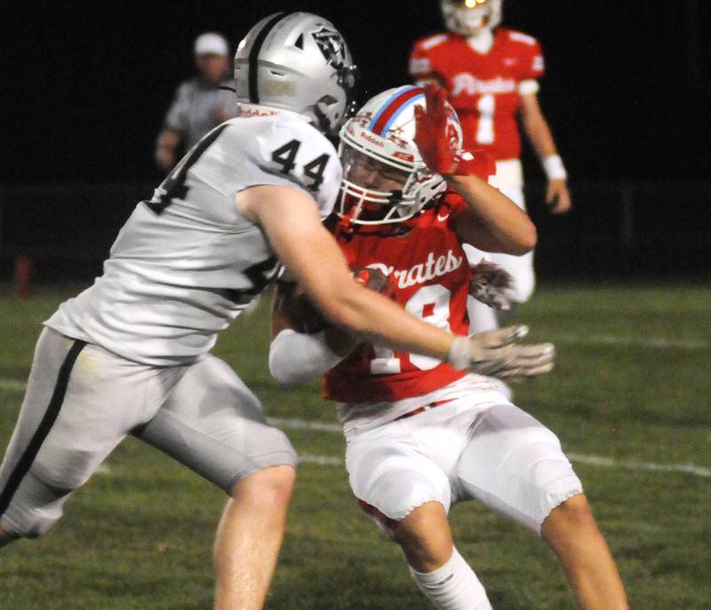 Kaneland's Roan O'Neil tackles Ottawa's Jack Pongracz at King Field on Friday, Sept. 20, 2024.