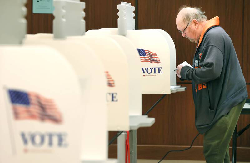 DeKalb resident Steve Walt makes his selections on Election Day Tuesday, April 4, 2023, at the polling place in Barsema Alumni and Visitors Center at Northern Illinois University in DeKalb.