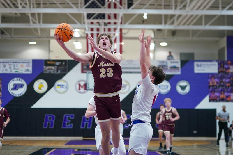 Morris’ Jack Wheeler (23) shoots the ball in the post against Marmion’s Brendan Kavanaugh (14) during a basketball game in the opening round of the 61st annual Plano Christmas Classic at Plano High School on Monday, December 23, 2024.