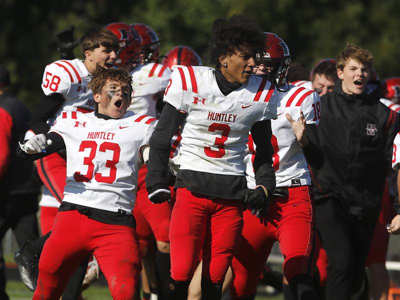 Huntley players celebrate their one point win over Cary-Grove during a Fox Valley Conference football game on Saturday, Oct. 7, 2023, at Cary-Grove High School.