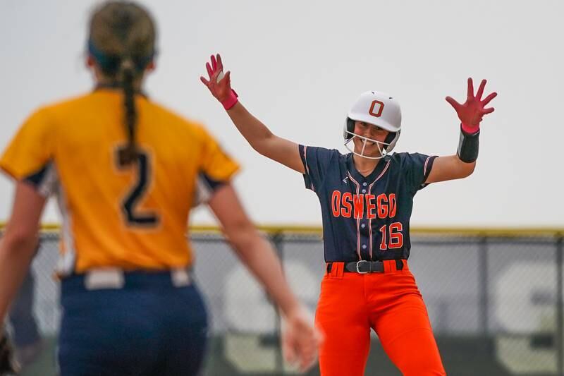 Oswego’s Rikka Ludvigson (16) reacts after reaching second base on an error by Neuqua Valley during a Class 4A Oswego East Regional Final softball game at Oswego East High School on Friday, May 30, 2025.