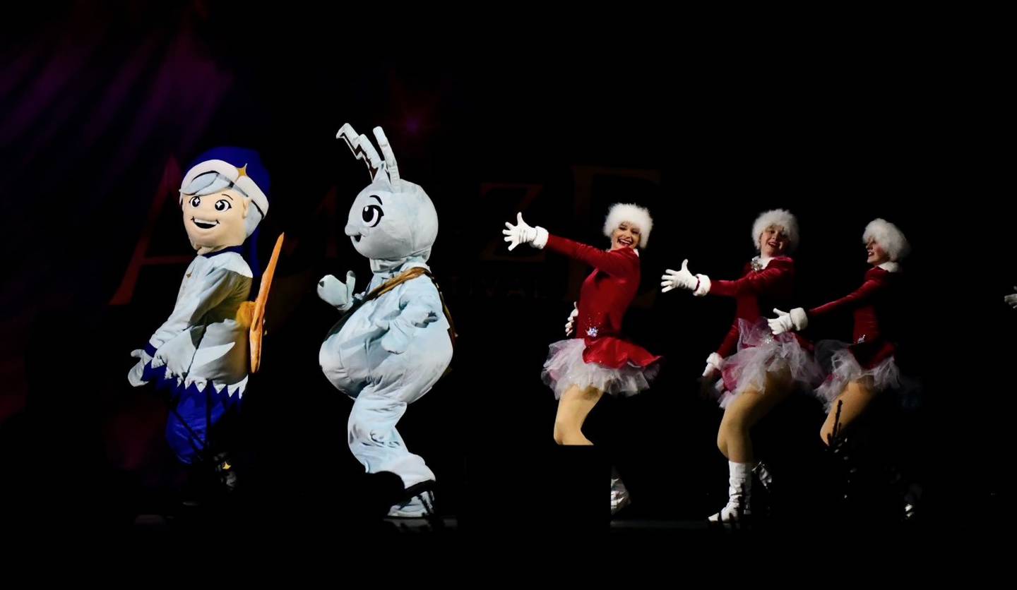The On-Broadway dancers perform with Zing and Sparky during the AMAZE Light Festival Stage show.