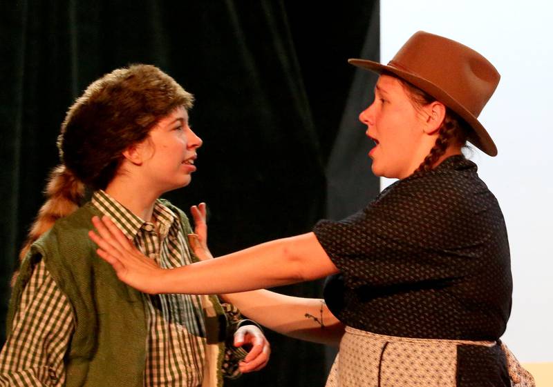 Allesyn Wilke (left) and Chloe Clayton act out a scene during a rehearsal of "The Trail to Oregon!" on Wednesday, Sept. 5, 2024, at Stage 212 in La Salle.