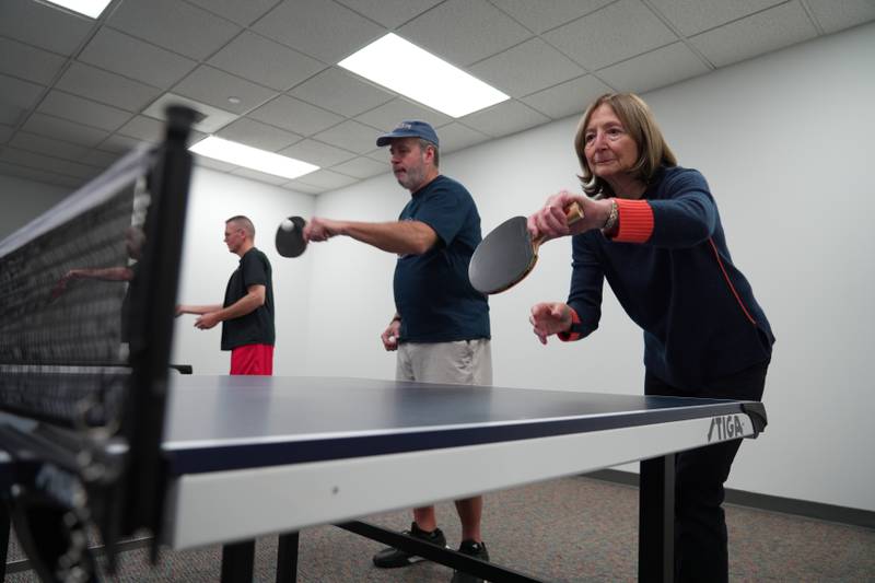 Drills include dual tasks, such as walking or lateral steps while bouncing the ball. Partner drills include counting aloud how many times you hit the ball, which activates the voice and encourages socialization.