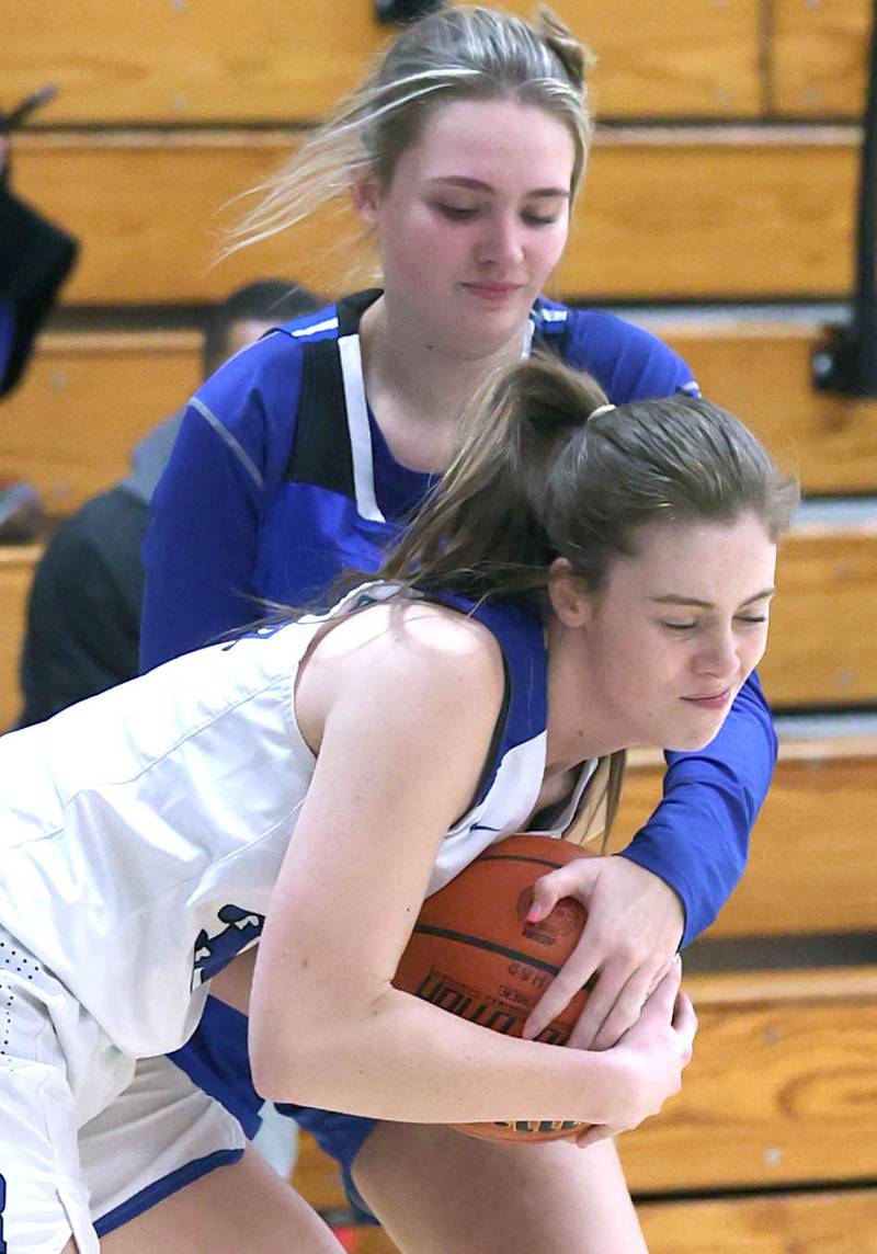 Hinckley-Big Rock's Alyssa Swanson tries to steal the ball from Westminster Christian's Emma Faidley during their regional semifinal game Monday, Feb. 13, 2023, at Hinckley-Big Rock High School.