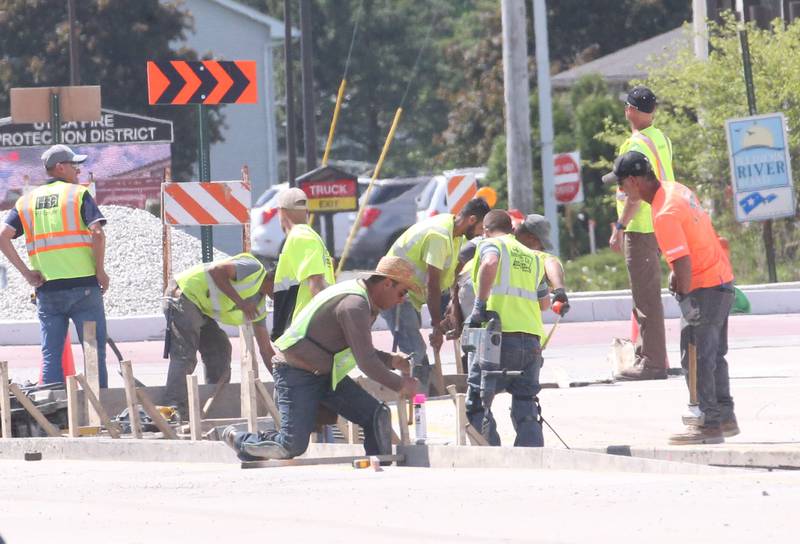 Workers build forms as they prepare to pour concrete on the approach to the roundabout on Tuesday, May 16, 2023 at the intersection of Illinois Route 178 and U.S. Route 6 in Utica.