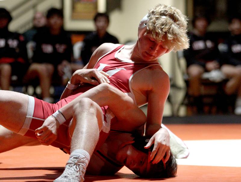 Crystal Lake Central’s Tommy Tomasello, bottom, battles Huntley’s Radic Dvorak in a 157-pound bout in varsity wrestling at Crystal Lake Friday. Dvorak won the match.