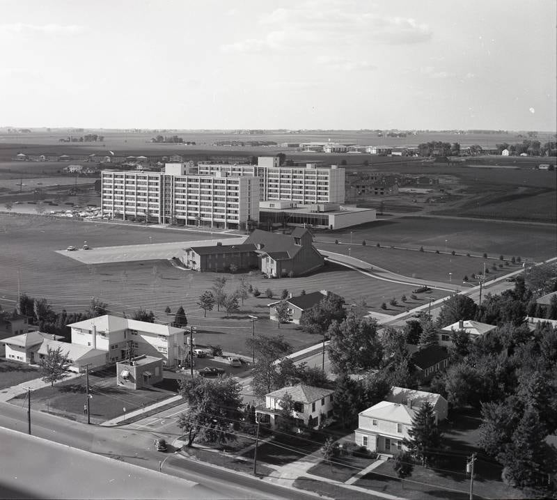 Looking northwest toward Lucinda Avenue and Russell Road from the balcony of NIU's Holmes Student Center circa 1971. Immanual Lutheran Church and University Plazza appear at center with University Village under construction at Crane Drive.
