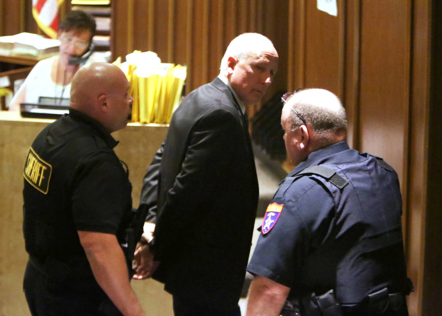 David Hatyina is taken away in hand cuffs after being sentenced to 10 years in prison by judge Clinton Hull at the Lake County Courthouse in Waukegan, Ill., on Friday, June 14, 2013. Hatyina plead guilty earlier this year to killing 10 year-old Tony Borcia in a boat accident in July 2012.