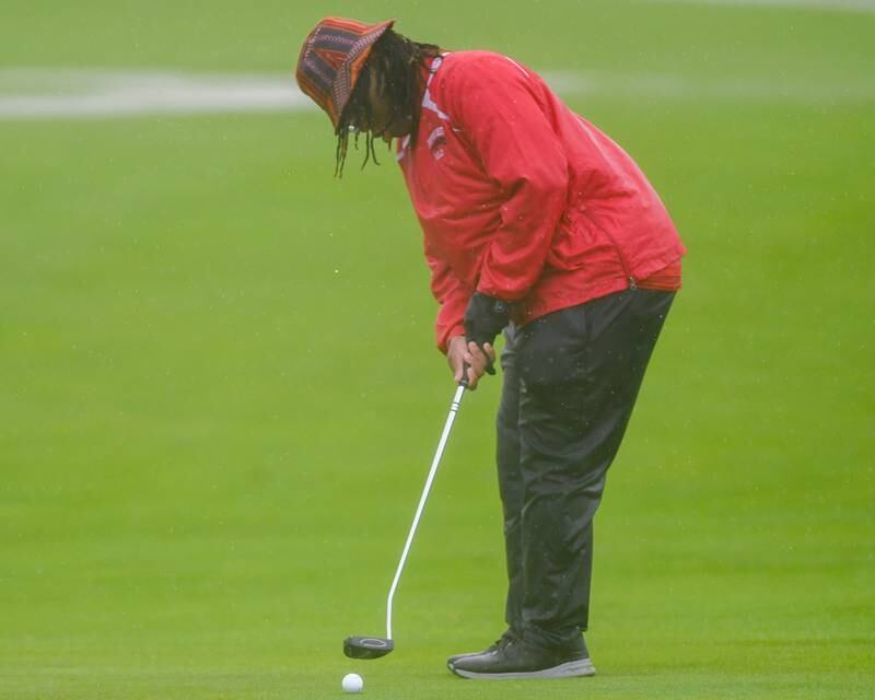 Proviso West 's golfer Joaquin Johnson putts during the West Suburban golf match on Tuesday Sept. 24, 2024, held at Prairie Bluff Golf Course in Crest Hill. Where Joaquin got a hole in one earlier in the round.