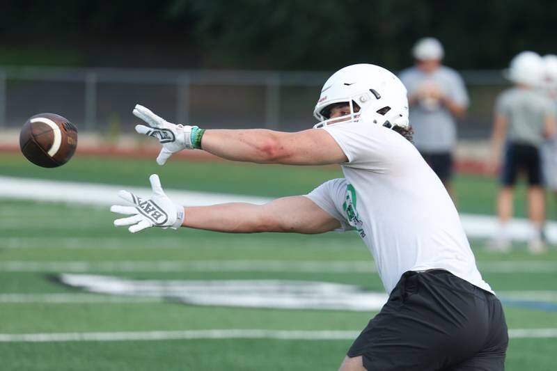 Providence’s Alex Gibson stretches for a catch during the first day of practice on Monday, Aug. 7, 2023 in New Lenox.