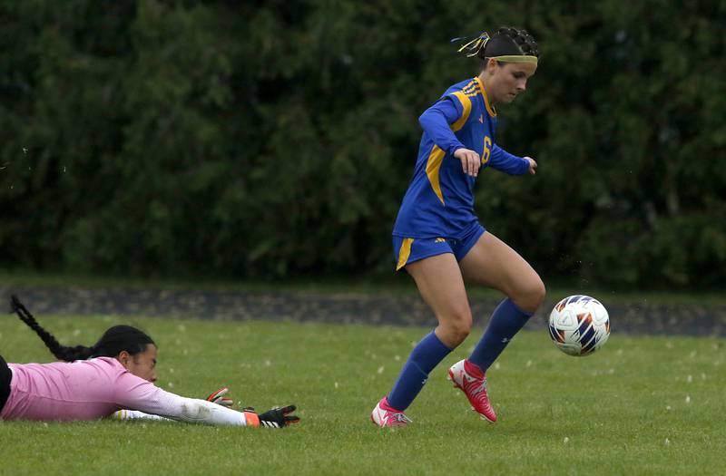 Johnsburg's Liz Smith score the first of her three goals after getting past Harvest Christian Academy' goalkeeper Tia Bales during the Class 1A Marian Central Girls Soccer Regional Championship match on Tuesday, May 20, 2025, at Marian Central High School in Woodstock.