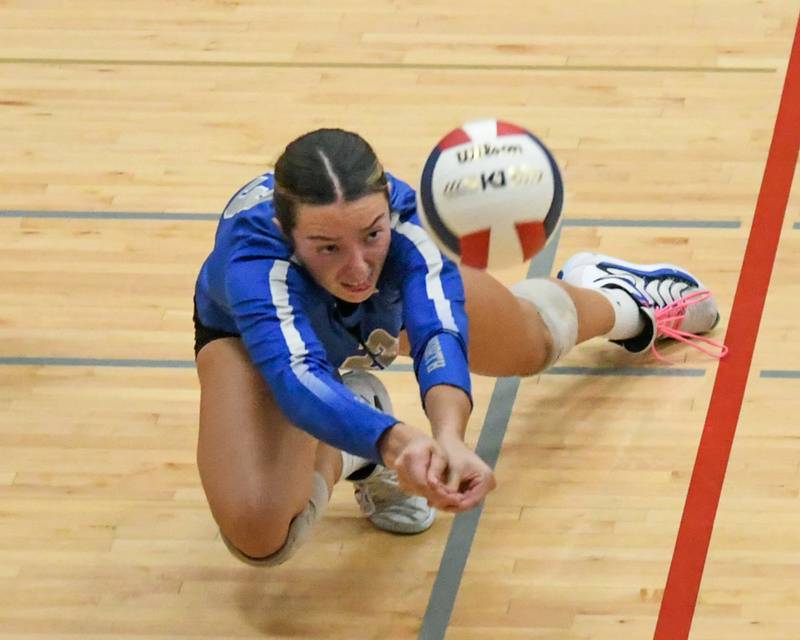 St. Charles North's Haley Burgdorf (23) digs for the ball during the 4A ectional championship game while taking on Benet Academy on Thursday Nov. 7 2024, held at West Aurora High School.