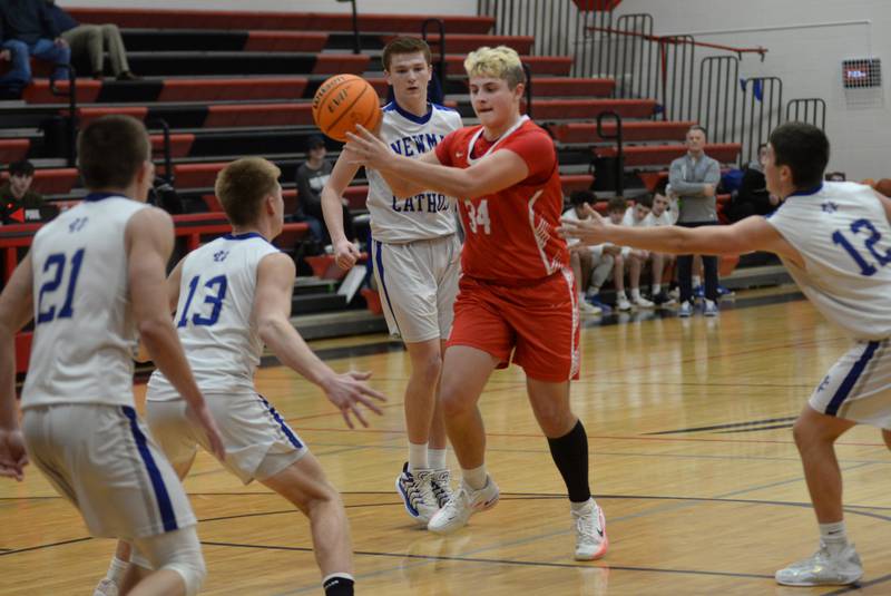 Oregon's Kade Girton (34) drives and dishes against Sterling Newman on Wednesday, Dec. 18, 2024 at the 63rd Annual Forreston Holiday Tournament.