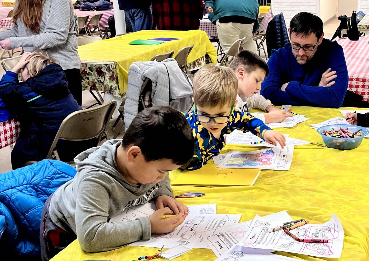 Cub scouts work on their Bobcat badge during Monday's meeting in Princeton.