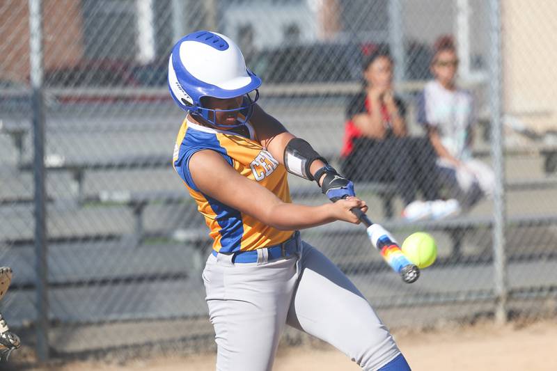 Joliet Central’s Joselyn Davenport drives in a run against Joliet West on Tuesday, April 9, 2024.