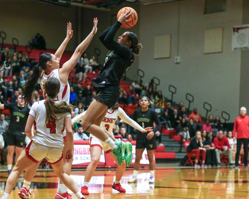 Waubonsie Valley's Arianna Garcia (1) hangs in the air on a shot attempt during their Class 4A Bolingbrook Sectional final basketball game between Waubonsie Valley at Benet. Feb 27, 2025 in Bolingbrook.