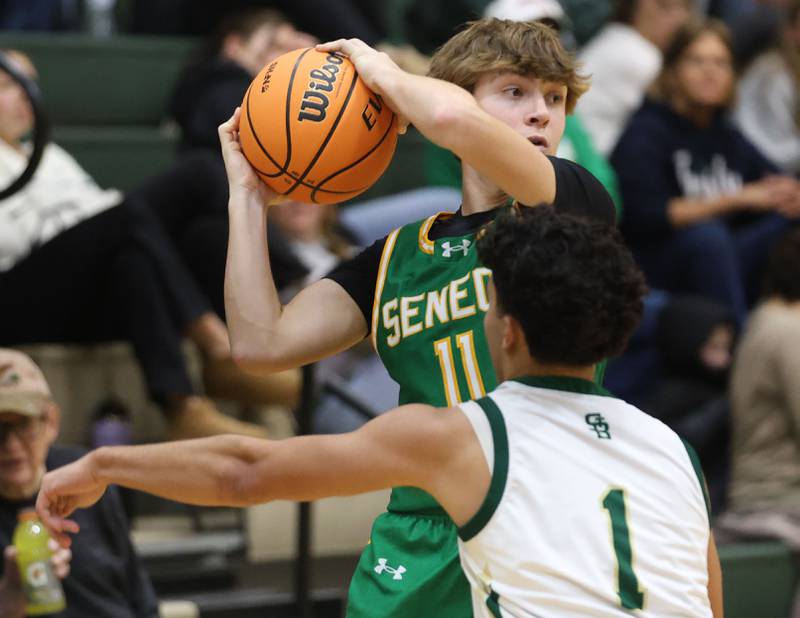 Seneca's Miles LeRoy looks to pass the ball around St. Bede's Jose Delatorre on Tuesday, Dec. 16, 2025 at St. Bede Academy.