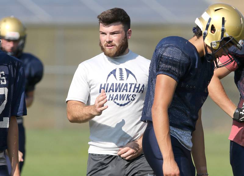 New Hiawatha head football coach NIck Doolittle gives some instruction during practice Monday, Aug. 16, 2021 at the school in Kirkland.