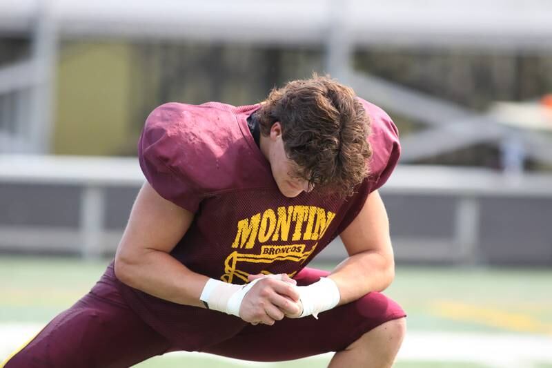 The team goes through stretching before Montini High School football practice. Aug 22 2024.