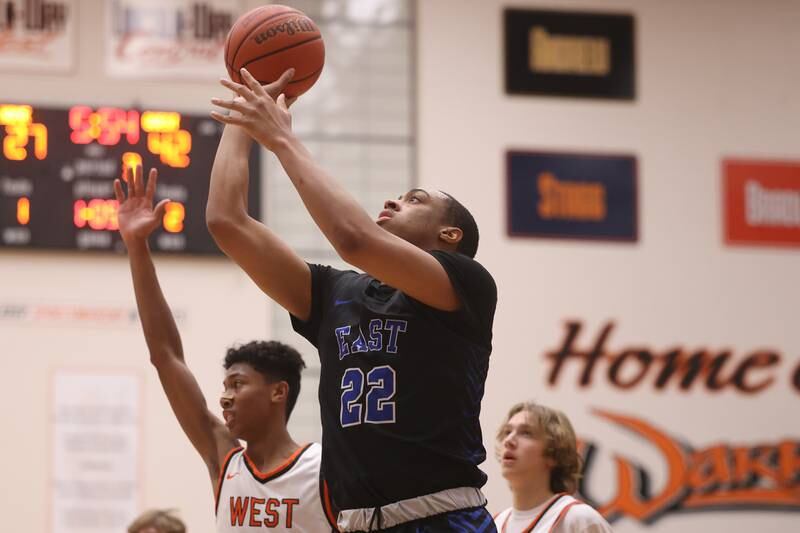 Lincoln-Way East’s Kyle Olagbegi puts up a shot against Lincoln-Way West.