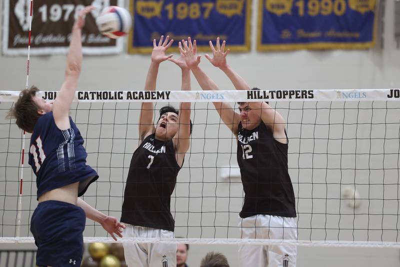 Joliet Catholic’s Patrick Duncan-Abushalback, left, and Austin Bernhard go for the block against St. Viator on Wednesday, April 24, 2024 in Joliet.