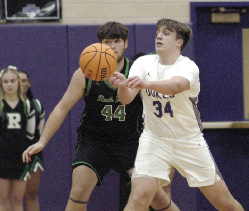 Dixon's Jacob Nicklaus tosses the ball to another player. Dixon hosted Rock Falls in boys basketball Friday, February 14, 2025 at Lancaster Gym at Dixon High School. Rock Falls won a hard fought game 48-46.