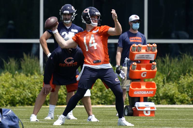 Chicago Bears quarterback Andy Dalton looks to pass during NFL football practice in Lake Forest, Ill., Wednesday, June 2, 2021