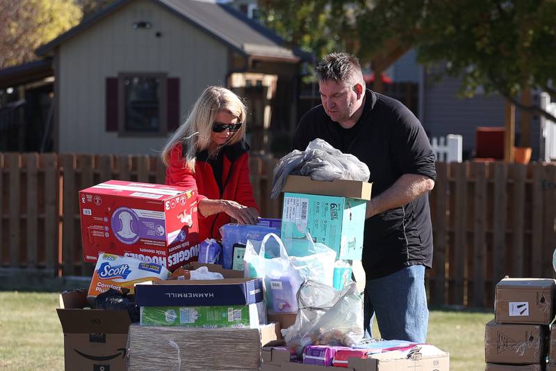 Joliet City Council member Jan Hallums Quillman and John Lukancic organize donations to be delivered to Bristol Motor Speedway, Tennessee for the victims of Hurricanes Helene and Milton at the city of Joliet and Cadence Cares Foundation relief drive on Saturday, Oct. 19, 2024 in Joliet.