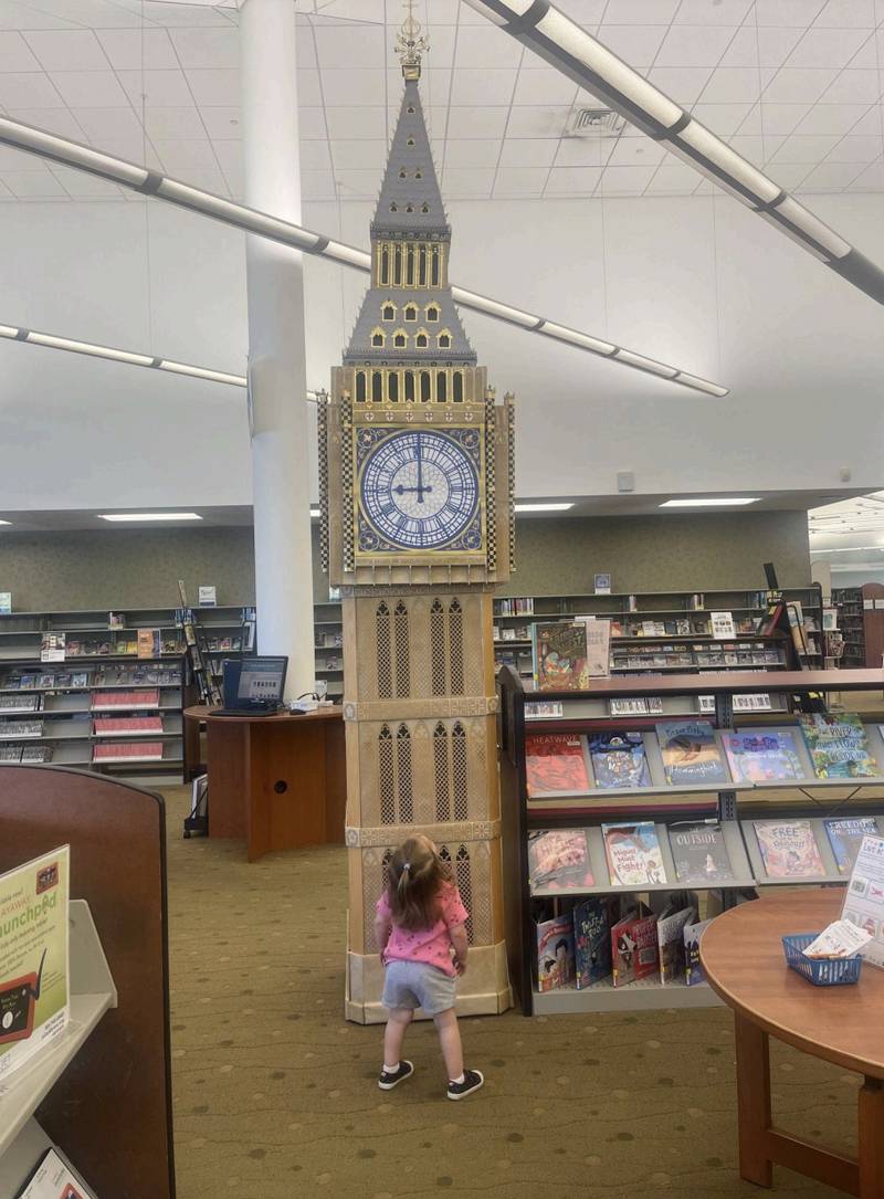 A young patron checks out the Big Ben replica at the Joliet Public Library's Black Road Branch.
