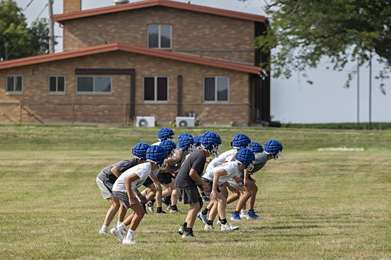 Newman players run through drills during first day of football practice Monday, August 7, 2023.