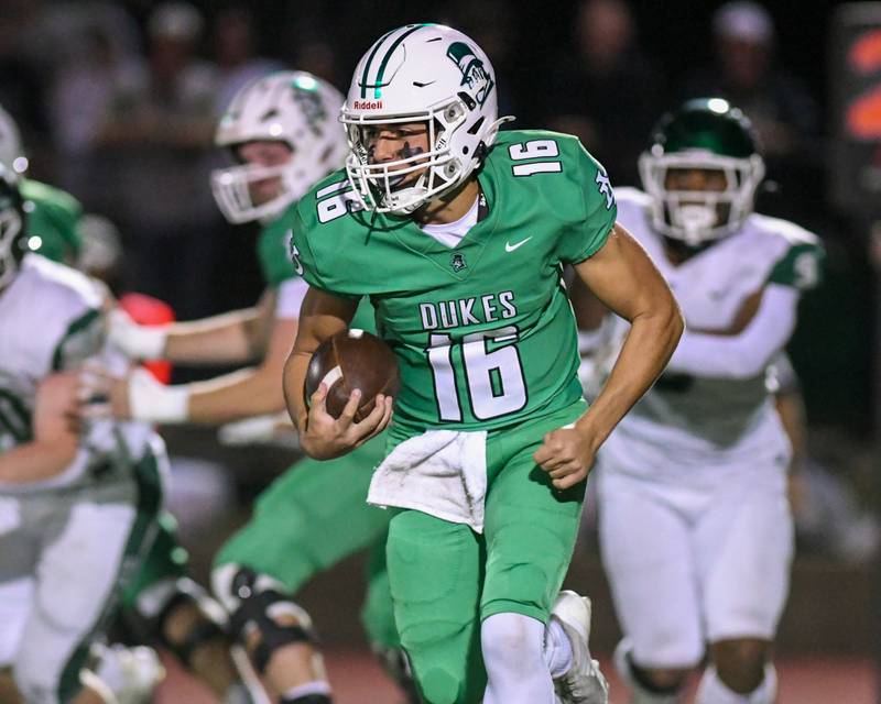 York's Zack Assaad (16) runs the ball during the game on Friday Oct. 17, 2025, while taking on Glenbard West held at York High School.