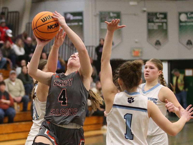 Flanagan-Cornell/Woodland's Aubry Edens eyes the hoop as Cissna Park's Julie Edelman defends the lane during the Class 1A Sectional semifinal game on Tuesday, Feb. 25, 2025 at Midland HIgh School.