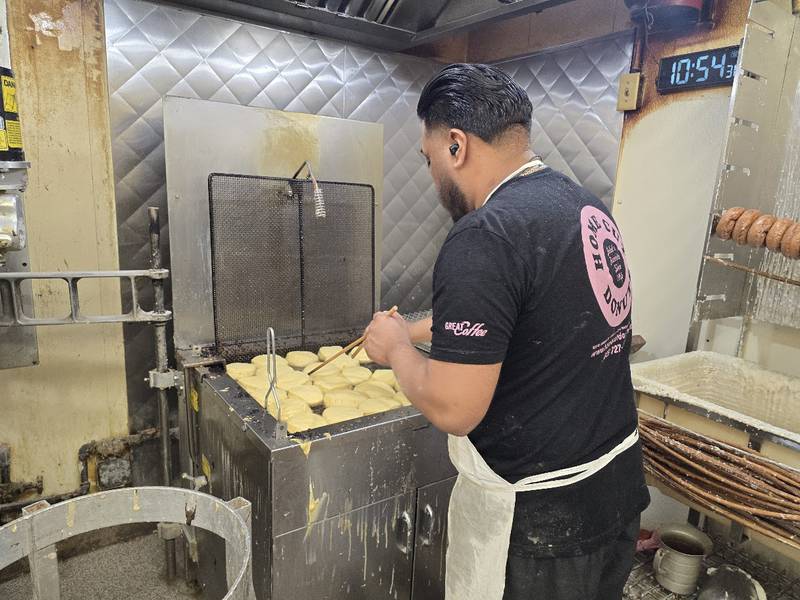 An employee of Home Cut Donuts in Joliet fries a batch of Paczki, a traditional jelly-filled, doughnut-like pastry, which many people enjoy before the start of the Christian Lent, on Saturday, Feb. 14, 2026.