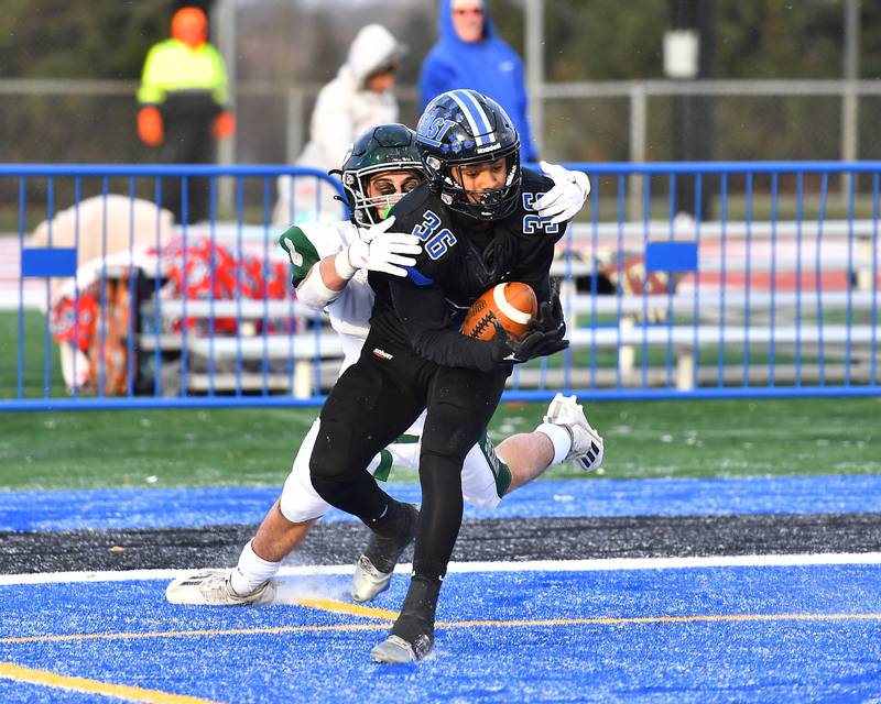 Lincoln-Way East's Stephon Gist-Gardner Jr. intercepts a pass in the end zone late in the fourth quarter during the IHSA Class 8A semifinals on Saturday, November 19, 2022, at Frankfort.