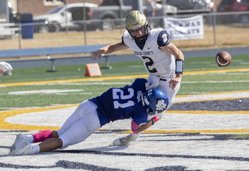 Newman’s Rylan Alvarado knocks the ball out of Mercer County QB John Baldwin’s hands for a fumble Saturday, October 4, 2025.