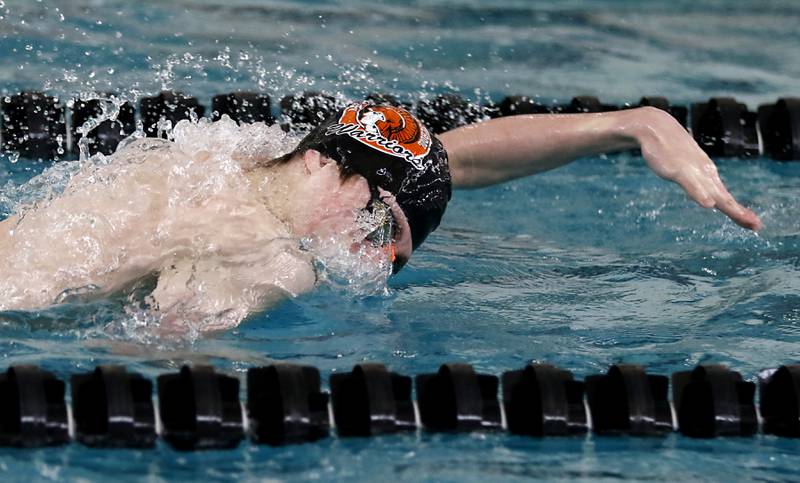 McHenry’s Robbie Rosenbaum competes in the 100 Freestyle during the Fox Valley Conference Invitational swim meet on Saturday,  Feb. 15, 2025, at Woodstock North High School.