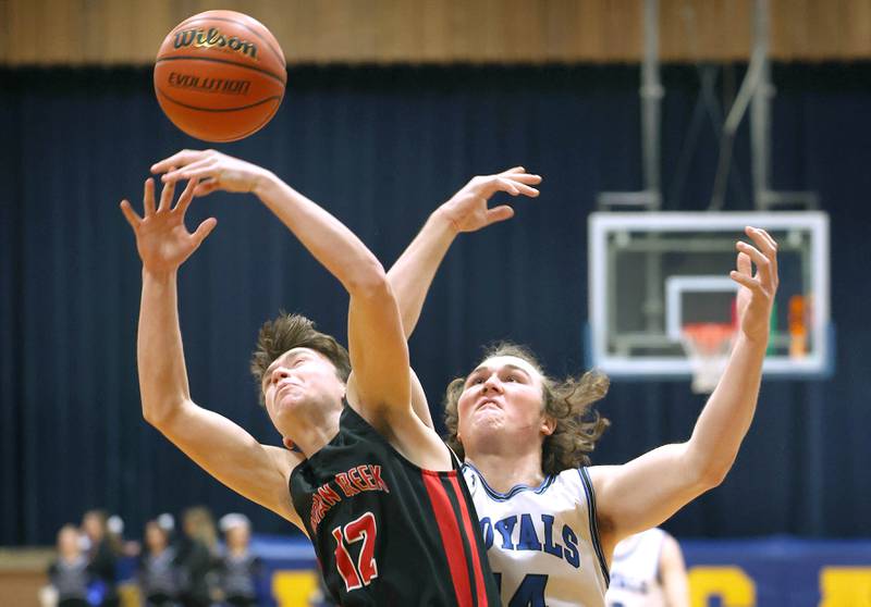 Indian Creek's Jakob McNally and Hinckley-Big Rock's Martin Ledbetter go after a rebound during their game Tuesday, Jan. 31, 2023, in the Little 10 Conference Basketball Tournament at Somonauk High School.