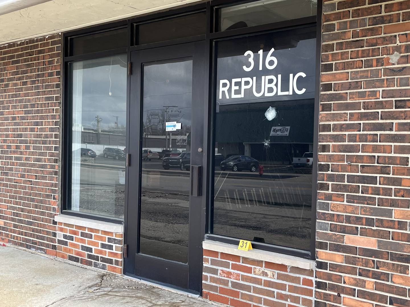 A damaged window of a building at 316 Republic Avenue in Joliet that police believe was struck by gunfire in a shooting on Thursday, March 14.