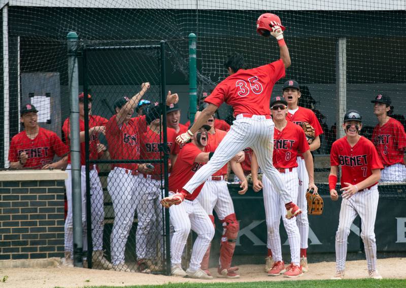 Benet Academy celebrates an RBI during the Class 3A Kaneland Sectional final against St. Francis High School at Kaneland High School in Maple Park on Saturday, June 7, 2025.
