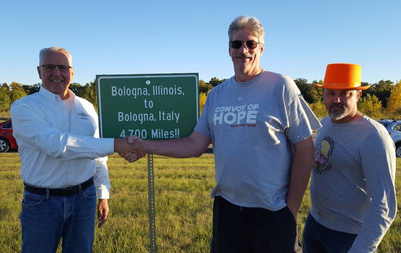 Pictured from left are Plano-Bologna-Sandwich 2022 co-mayors Greg Witek, Kendall County Food Pantry Chairman, and Jeff Ikemire, Harvest Chapel Director, with Sandwich Mayor Todd Latham.