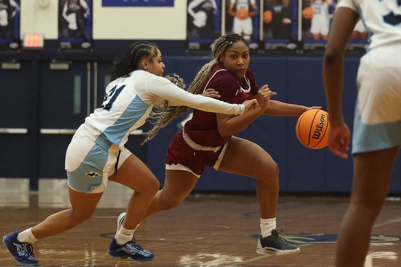 Plainfield North’s Anaya Patterson makes a move at the top of the key against Plainfield South on Thursday, Jan 9, 2025.