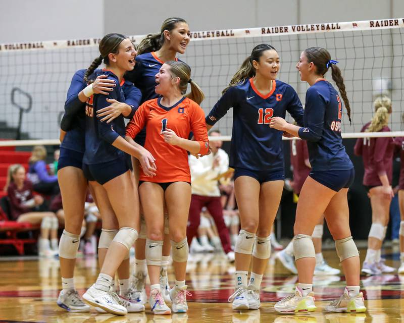 Oswego celebrates a point during Class 4A Bolingbrook Sectional final match between Lockport at Oswego.  Nov 7, 2024  in Bolingbrook.