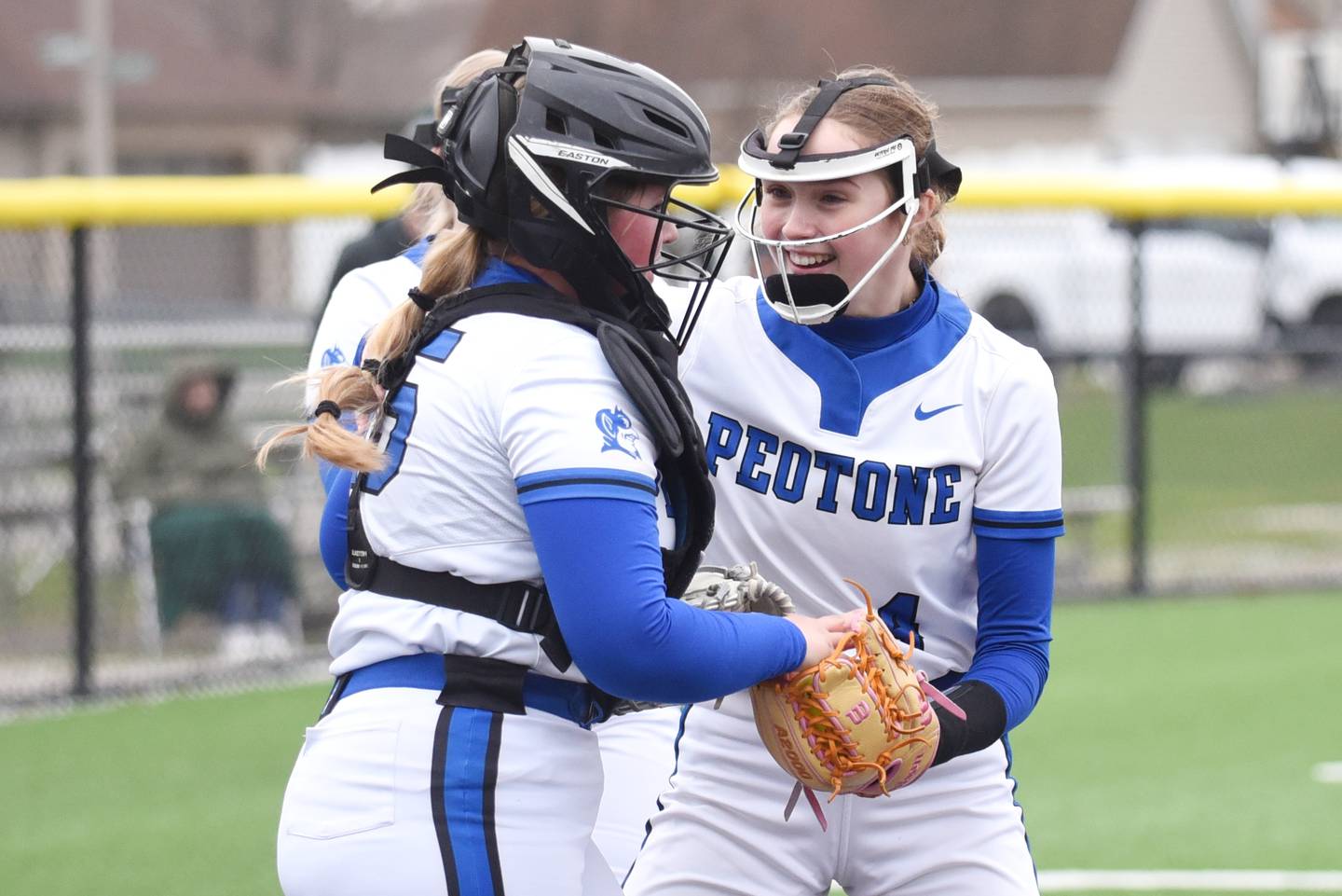 Peotone's Sophie Klawitter, right, congratulates Layla Johnson after making a catch during a game at Coal City Wednesday, April 9, 2025.