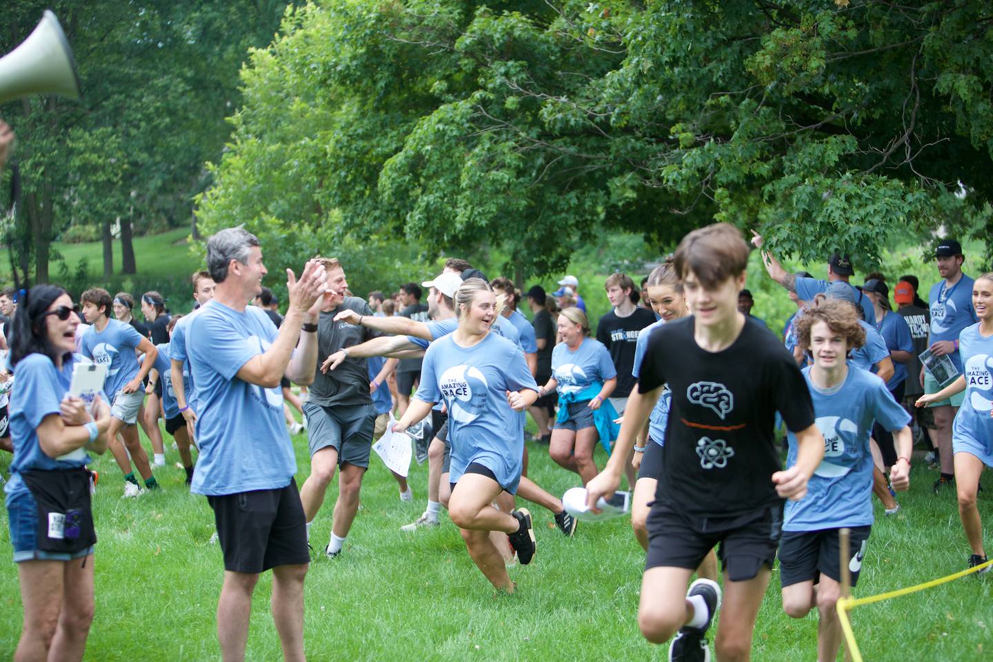 Participants run to the  start of  The Amazing Race Hardy Strong at Mt. St. Mary Park in St. Charles on Saturday, August 5, 2023