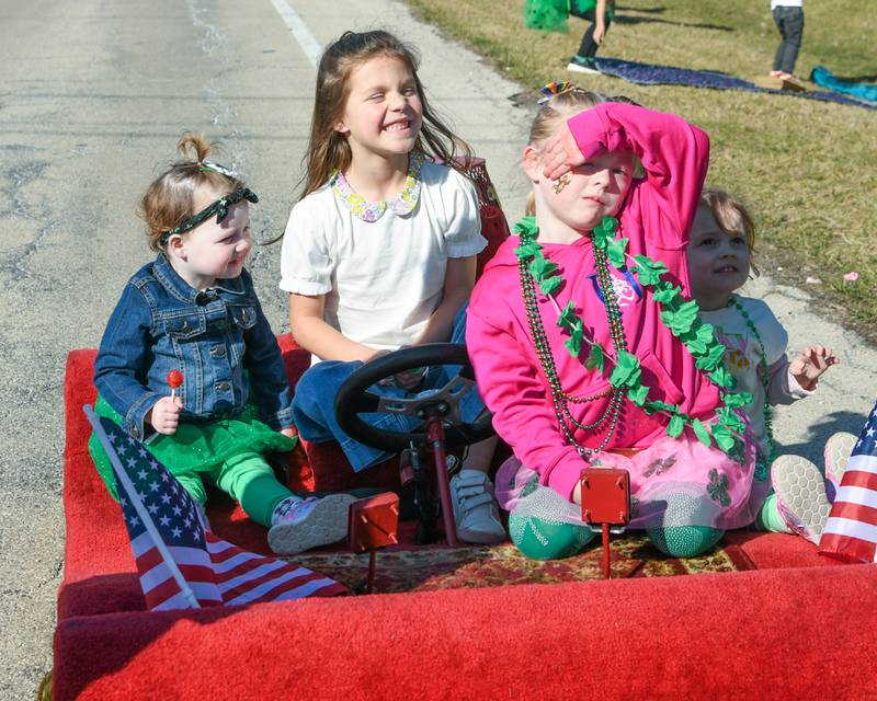 Clodagh Shields, 2, of La Grange Victoria Schmeski, 6, of Lamont, Caoimhe Shield, 4, La Grange and McKenzie Christopherson, 2, of Naperville all pose for a photo on a Medinah Shriners carpet during the Countryside St. Patrick’s Day parade held on Saturday March 2, 2024.