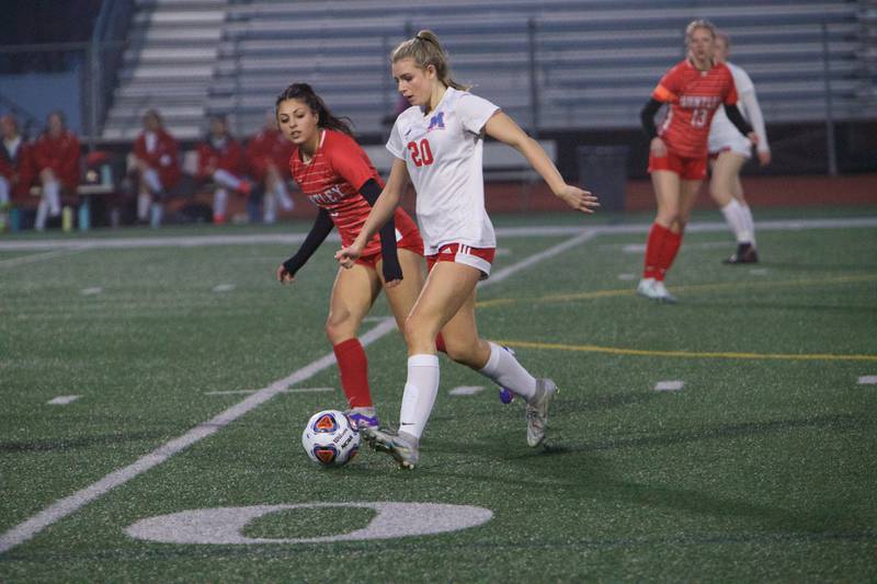 Marian Central's Adriana Wrzos looks to advance the ball against Huntley on Wednesday March 22, 2023 in Huntley.