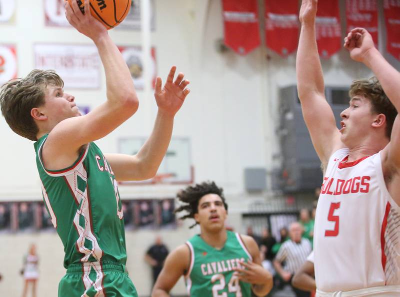L-P's Braylin Bond takes a shot over Streator's Isiah Weibel during the Class 3A Regional title game on Friday, Feb. 28, 2025 in Sellett Gymnasium at L-P High School.