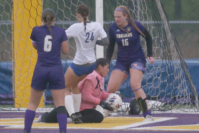 Mendota keeper Ariana Sanchez blocks a kick from Princeton Keighley Davis as teammates Kaley Siemer (6) and Elaina Reddin (16) help on the play during the Class 1A Regional final game on Tuesday, May 20, 2025 at Mendota High School.