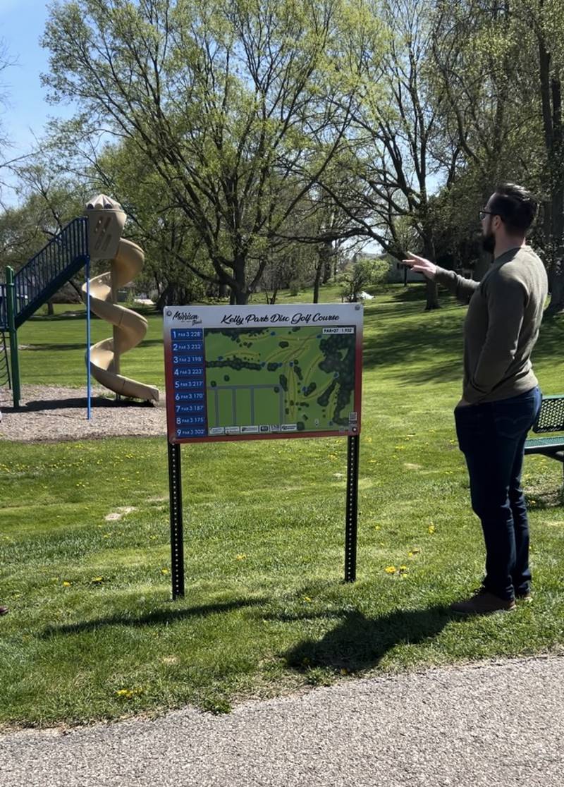 Morrison Recreational Services Director Nathan Jacobs points out the new features at Morrison's new disc golf course at Kelly Park on Thursday, April 25, 2024.